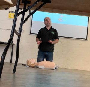 Picture of a trainer Mathew delivering first aid training