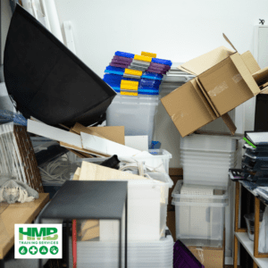 A picture of boxes and clutter stacked onto of each other in a cupboard 5 Top Reasons Why Reducing Clutter Improves Mental Health
